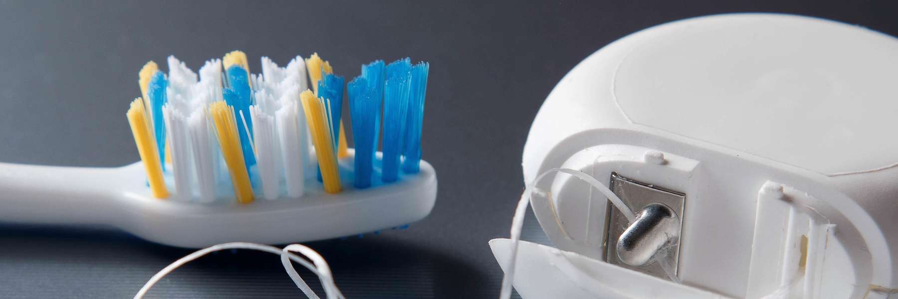 close up of tooth brush and floss | melbourne dentist