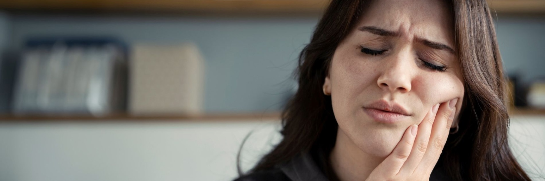 Woman holding her jaw in pain, pascoe vale vic