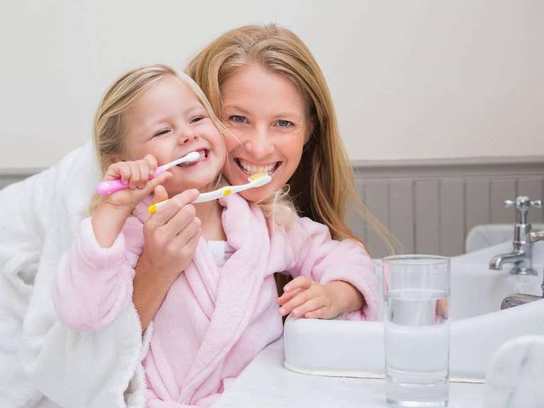 Mom and daughter brushing teeth together, pascoe vale vic