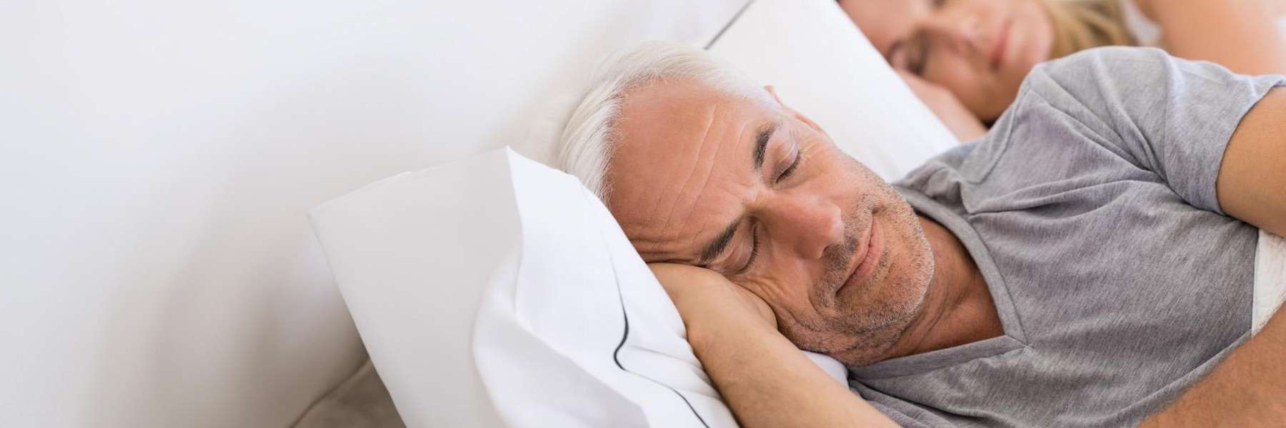 Older man sleeping on a pillow smiling, pascoe vale vic